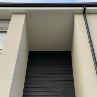 White upvc fascia soffit boards, with black seamless aluminium guttering