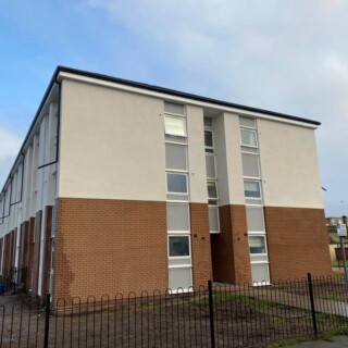 White upvc fascia soffit boards, with black seamless aluminium guttering